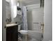 Well-lit bathroom featuring a vanity, a shower-tub combination with a decorative shower curtain, and neutral accents at 6001 S Kings Hwy., Myrtle Beach, SC 29575