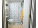 Charming bathroom featuring a toilet and decorative shower curtain, creating a serene and refreshing space at 6001 S Kings Hwy., Myrtle Beach, SC 29575