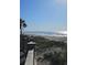 A view of the wide sandy beach and ocean beyond from a wooden boardwalk path at 6001 S Kings Hwy., Myrtle Beach, SC 29575