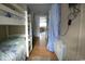 Bedroom with well-placed bunk beds, showcasing the natural light and access to other rooms at 6001 S Kings Hwy., Myrtle Beach, SC 29575