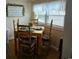 Inviting dining area featuring a wooden table with seating for four, adorned with decorative place settings at 6001 S Kings Hwy., Myrtle Beach, SC 29575