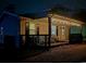 This single-story home has a covered porch with outdoor seating and lighting for evening enjoyment at 6001 S Kings Hwy., Myrtle Beach, SC 29575