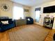 Cozy living room with plush seating, warm wood floors, and a large area rug at 6001 S Kings Hwy., Myrtle Beach, SC 29575