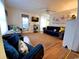 Comfortable living area featuring a sofa, loveseat, television, and ceiling fan at 6001 S Kings Hwy., Myrtle Beach, SC 29575