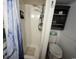 Modern shower featuring a white tile and a decorative shower curtain, creating a refreshing and functional space at 6001 S Kings Hwy., Myrtle Beach, SC 29575