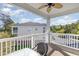 Relaxing covered balcony with seating offers a view of the manicured grounds and ample parking at 6015 Catalina Dr. # 134, North Myrtle Beach, SC 29582