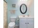 A cozy bathroom featuring a vanity, toilet, and a shower with a starfish-themed curtain at 6015 Catalina Dr. # 134, North Myrtle Beach, SC 29582
