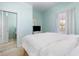 Bedroom featuring carpet, a window for natural light, and a closet with mirror doors at 6015 Catalina Dr. # 134, North Myrtle Beach, SC 29582