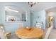 Dining room featuring a wooden table set, open to the kitchen and bathed in natural light at 6015 Catalina Dr. # 134, North Myrtle Beach, SC 29582