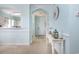 Inviting home entryway with tiled floors, neutral tones and decorative console table at 6015 Catalina Dr. # 134, North Myrtle Beach, SC 29582