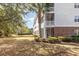 Well-maintained condo building with lush landscaping, mature trees, and multiple screened-in balconies at 6015 Catalina Dr. # 134, North Myrtle Beach, SC 29582