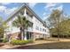 Well-maintained condo building with lush landscaping, mature trees, and multiple screened-in balconies at 6015 Catalina Dr. # 134, North Myrtle Beach, SC 29582