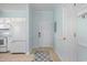 Functional kitchen with white appliances, tile floors and convenient access to the door at 6015 Catalina Dr. # 134, North Myrtle Beach, SC 29582