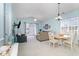 Bright living room with sliding glass doors, ceiling fan, and an adjacent dining area at 6015 Catalina Dr. # 134, North Myrtle Beach, SC 29582