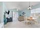 Combined living and dining area with a vaulted ceiling and sliding glass doors to a balcony at 6015 Catalina Dr. # 134, North Myrtle Beach, SC 29582