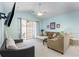 Comfortable living room with vaulted ceilings and sliding glass doors to a private patio at 6015 Catalina Dr. # 134, North Myrtle Beach, SC 29582