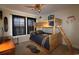 Cozy bedroom featuring wood bunk beds, ceiling fan, and window with dark curtains at 6172 Catalina Dr. # 612, North Myrtle Beach, SC 29582
