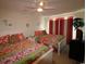 Cozy bedroom with two beds, colorful decor and a ceiling fan at 6172 Catalina Dr. # 612, North Myrtle Beach, SC 29582