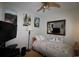 This bedroom offers a ceiling fan, TV, and mirror over a small bed at 6172 Catalina Dr. # 612, North Myrtle Beach, SC 29582