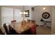 Bright dining area with a chandelier, large windows, and seating for six is perfect for entertaining guests at 6172 Catalina Dr. # 612, North Myrtle Beach, SC 29582