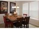 Cozy dining room features a chandelier, marble table top, and artwork that adds a touch of elegance at 6172 Catalina Dr. # 612, North Myrtle Beach, SC 29582