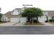 Charming townhome with two-car garage, mature tree, and well-maintained landscaping at 6172 Catalina Dr. # 612, North Myrtle Beach, SC 29582