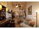 Open-concept living room with high ceilings, fireplace, and bar at 6172 Catalina Dr. # 612, North Myrtle Beach, SC 29582