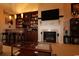 Elegant living room with fireplace, bar area, and TV at 6172 Catalina Dr. # 612, North Myrtle Beach, SC 29582