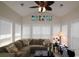 Inviting living room with vaulted ceilings, fan, lots of natural light, and a comfortable sectional sofa at 6172 Catalina Dr. # 612, North Myrtle Beach, SC 29582
