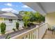 From balcony, colorful townhomes are surrounded by lush trees, providing a scenic view at 6500 Colonial Dr. # 2, Myrtle Beach, SC 29572