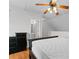 Cozy bedroom features light walls, hardwood flooring, and a ceiling fan with a light fixture at 6500 Colonial Dr. # 2, Myrtle Beach, SC 29572