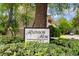Rainbow Row at 65th street community sign surrounded by lush greenery at 6500 Colonial Dr. # 2, Myrtle Beach, SC 29572