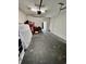 Unfinished garage area features a bare concrete floor and an assortment of household items at 6500 Colonial Dr. # 2, Myrtle Beach, SC 29572
