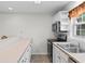 Bright kitchen featuring white cabinetry, stainless steel appliances, and a window view at 6500 Colonial Dr. # 2, Myrtle Beach, SC 29572