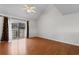 Living area featuring hardwood floors and a sliding glass door with decorative window coverings at 6500 Colonial Dr. # 2, Myrtle Beach, SC 29572