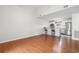 Open-concept living area featuring hardwood floors, kitchen bar, and access to the kitchen at 6500 Colonial Dr. # 2, Myrtle Beach, SC 29572