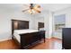 Spacious bedroom featuring hardwood floors, a ceiling fan, and natural light at 6500 Colonial Dr. # 2, Myrtle Beach, SC 29572