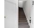 Stairway with carpeted steps ascends from the entry door, creating a welcoming space at 6500 Colonial Dr. # 2, Myrtle Beach, SC 29572