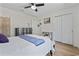 Cozy bedroom with a ceiling fan and a comfortable queen-sized bed, offering a relaxing retreat at 6630 W Sweetbriar Trail, Myrtle Beach, SC 29588