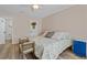 Inviting bedroom with comfortable bed, wooden floors, and natural light at 6630 W Sweetbriar Trail, Myrtle Beach, SC 29588