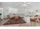Spacious living room with a large sectional sofa, a patterned rug, and an open layout, great for entertaining at 6630 W Sweetbriar Trail, Myrtle Beach, SC 29588