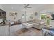 Bright and airy living room with a comfortable white sofa, stylish decor, and plenty of natural light at 6630 W Sweetbriar Trail, Myrtle Beach, SC 29588