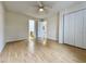 This bedroom has wood floors and a ceiling fan at 665 Tupelo Ln. # 17-D, Longs, SC 29568