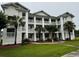 Exterior shot of building with balconies and mature trees at 665 Tupelo Ln. # 17-D, Longs, SC 29568