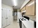 Functional kitchen featuring white appliances, light cabinets, and ample counter space at 665 Tupelo Ln. # 17-D, Longs, SC 29568