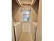 Convenient laundry room area featuring a washer, a dryer, and overhead shelving at 665 Tupelo Ln. # 17-D, Longs, SC 29568