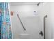 This bright bathroom shower features grab bars and shelving for added safety and convenience at 67 Bossie Ln., Georgetown, SC 29440