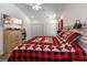 Comfortable bedroom featuring a ceiling fan, wood-look flooring, and a flat screen TV on dresser at 67 Bossie Ln., Georgetown, SC 29440