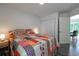 Cozy bedroom with neutral paint, bedside lamps, a closet, and light colored wood floors at 67 Bossie Ln., Georgetown, SC 29440