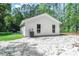 Rear exterior view showcasing the home's white siding and backyard area at 67 Bossie Ln., Georgetown, SC 29440